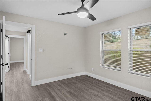 empty room featuring ceiling fan and hardwood / wood-style floors