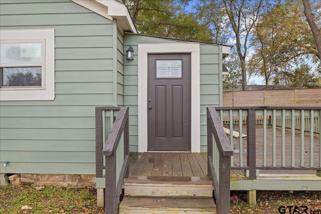 doorway to property featuring a wooden deck