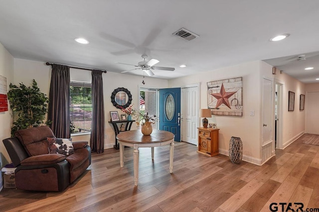 interior space featuring visible vents, baseboards, ceiling fan, recessed lighting, and light wood finished floors