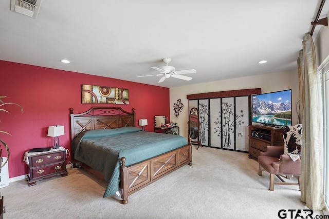 bedroom with carpet floors, recessed lighting, ceiling fan, and visible vents