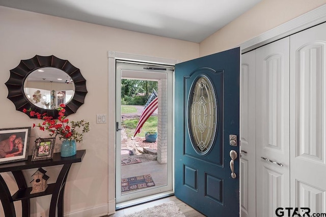 foyer entrance with baseboards