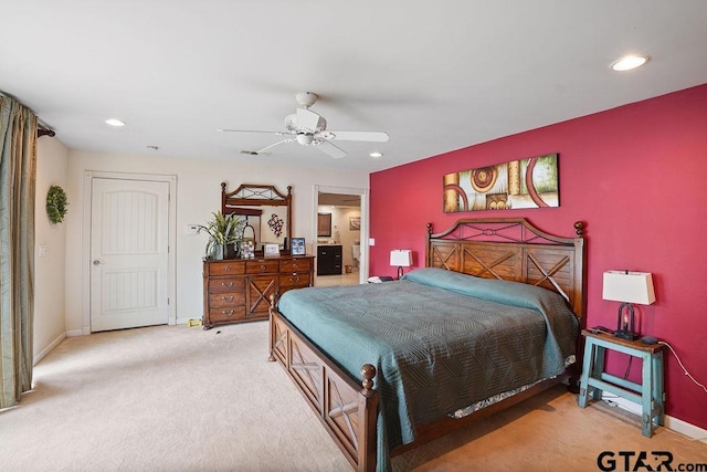 bedroom with baseboards, recessed lighting, and light colored carpet