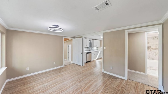 interior space with light hardwood / wood-style floors and crown molding