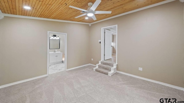 unfurnished room with light colored carpet, ceiling fan, ornamental molding, and wood ceiling