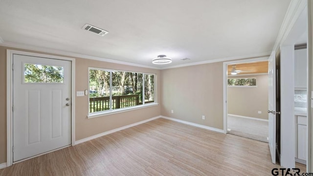 entryway featuring ornamental molding