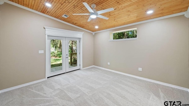 spare room featuring french doors, ceiling fan, ornamental molding, light colored carpet, and wood ceiling