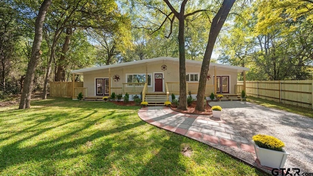 view of front facade with a front yard and a porch