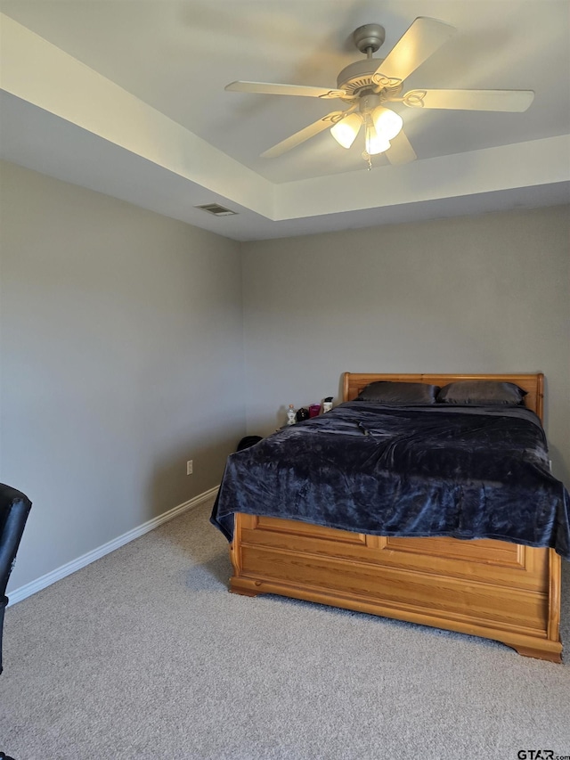 bedroom featuring a ceiling fan, carpet, visible vents, and baseboards