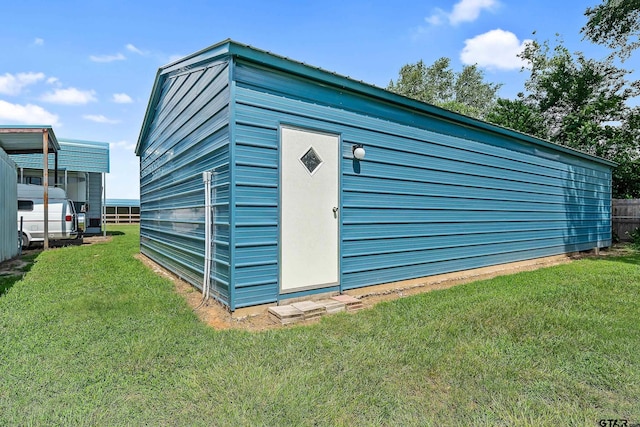 view of outdoor structure with a yard