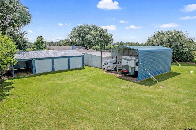 view of yard with an outdoor structure and a carport