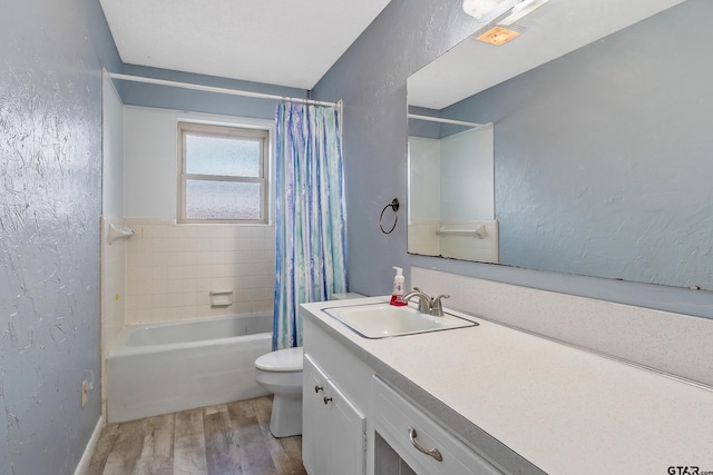 full bathroom featuring vanity, toilet, hardwood / wood-style floors, and shower / bath combo