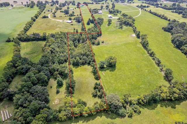 birds eye view of property with a rural view