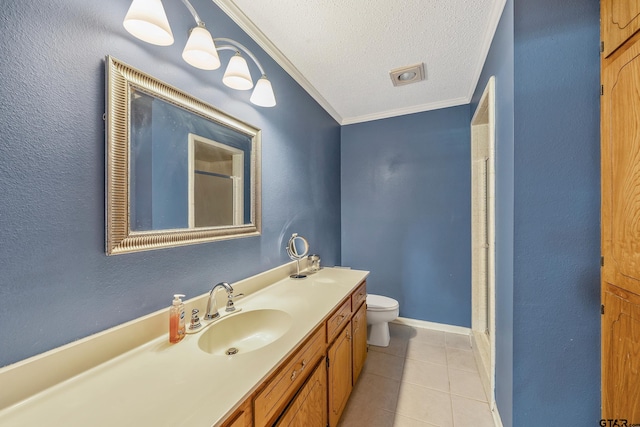 bathroom featuring vanity, tile patterned floors, toilet, ornamental molding, and a textured ceiling