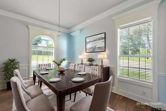 619 Court Rdg, Tyler, TX 75703 - dining space featuring ornamental molding, a decorative wall, dark wood-style flooring, and a wainscoted wall