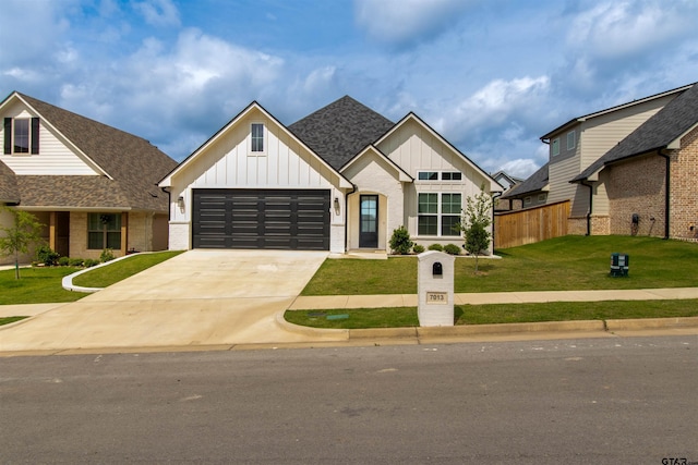 7013 Hillside Ave, Tyler, TX 75707 - view of front of home with board and batten siding, driveway, a garage, and brick siding