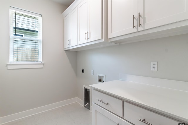 7013 Hillside Ave, Tyler, TX 75707 - laundry room featuring cabinet space, hookup for an electric dryer, baseboards, and washer hookup