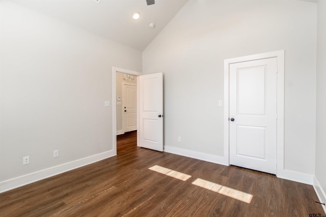 7013 Hillside Ave, Tyler, TX 75707 - unfurnished bedroom featuring high vaulted ceiling, baseboards, wood finished floors, and recessed lighting