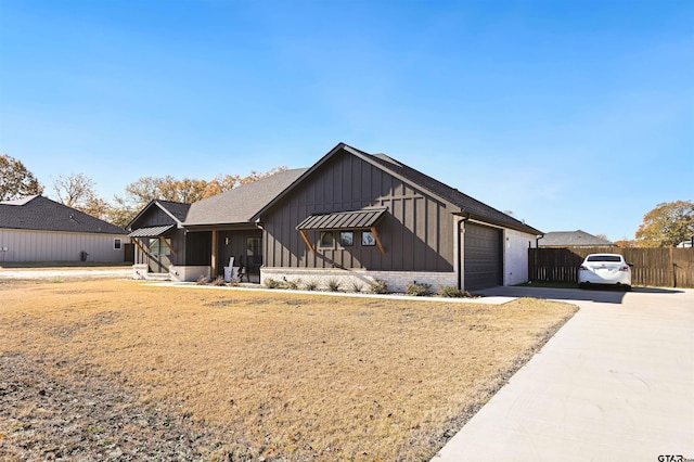 modern farmhouse style home featuring a garage