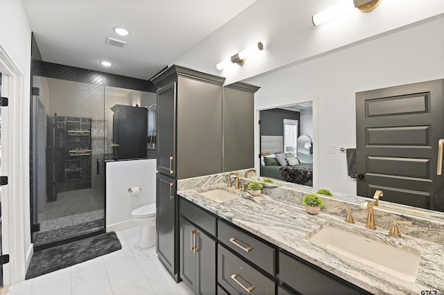 bathroom with vanity, toilet, and an enclosed shower