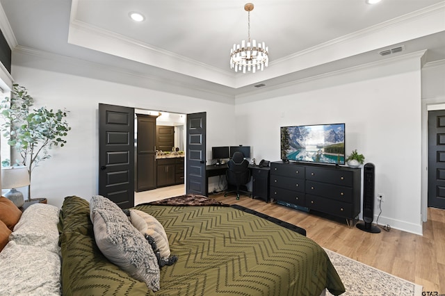 bedroom with ensuite bathroom, light hardwood / wood-style flooring, and crown molding