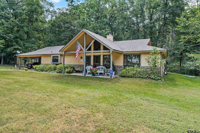 view of front of home with a porch and a front lawn