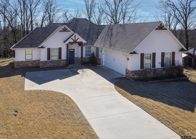 view of front facade with a garage and a front yard