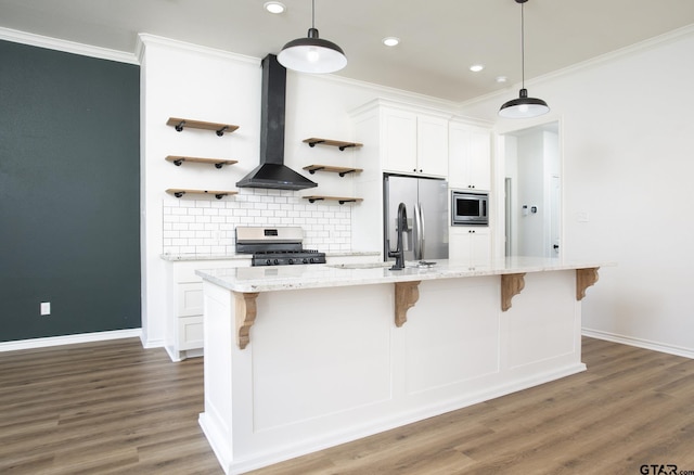 kitchen featuring white cabinetry, extractor fan, stainless steel appliances, and a center island with sink