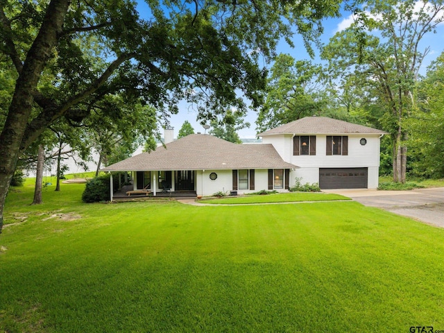 7016 Fm 3054, Malakoff, TX 75148 - view of front of house with an attached garage, covered porch, a front lawn, driveway, and a chimney