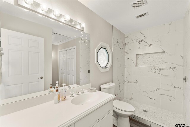 7016 Fm 3054, Malakoff, TX 75148 - full bathroom featuring vanity, tiled shower, and toilet