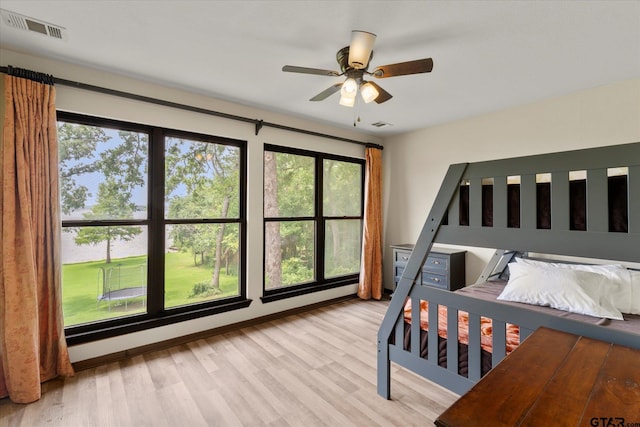 7016 Fm 3054, Malakoff, TX 75148 - bedroom with multiple windows and light wood-type flooring