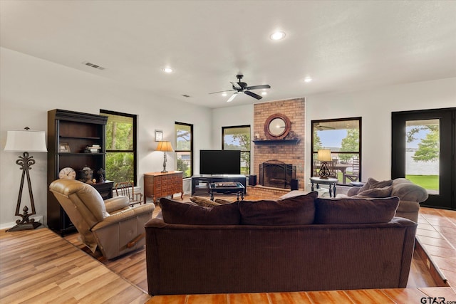 7016 Fm 3054, Malakoff, TX 75148 - living area featuring a ceiling fan, a brick fireplace, light wood-style flooring, recessed lighting, and baseboards