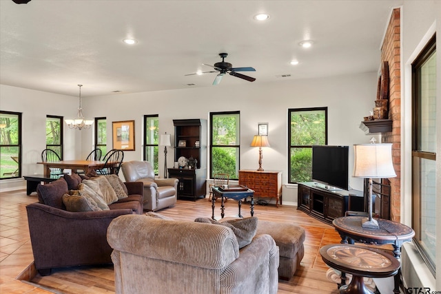 7016 Fm 3054, Malakoff, TX 75148 - living room featuring healthy amount of natural light, a chandelier, a ceiling fan, recessed lighting, and baseboards