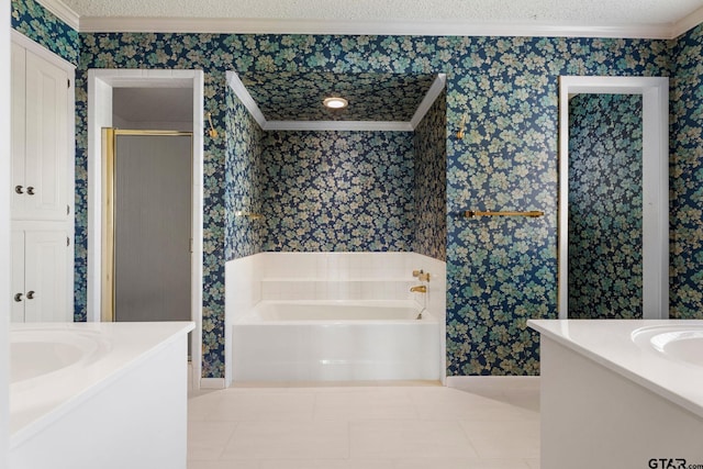 bathroom featuring tile patterned floors, vanity, a textured ceiling, and ornamental molding