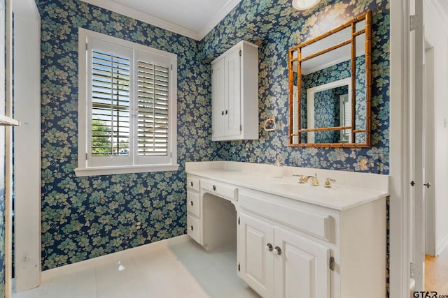 bathroom with tile patterned floors, vanity, crown molding, and a textured ceiling