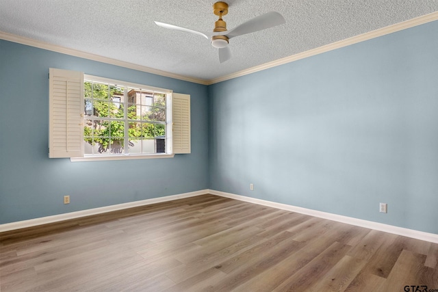 spare room featuring crown molding, light hardwood / wood-style flooring, and a textured ceiling