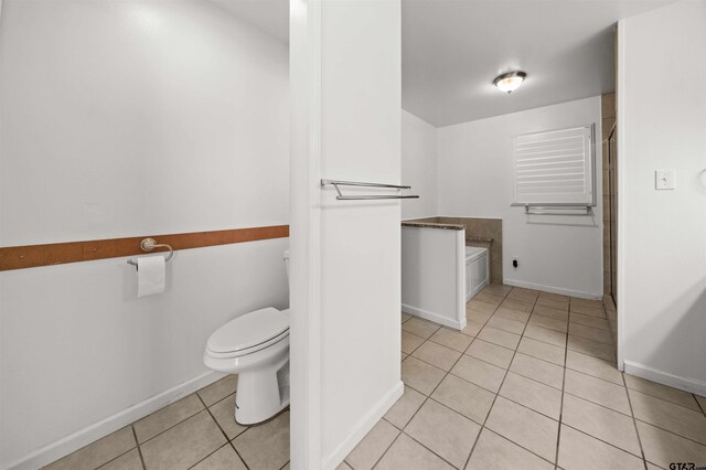 bathroom with tile patterned floors and toilet