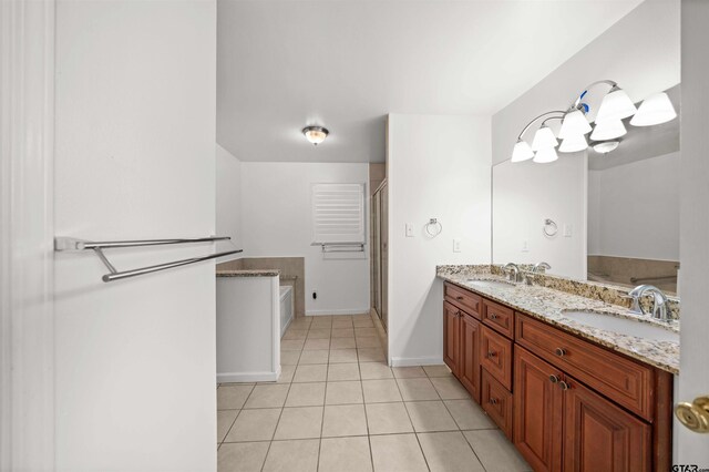 bathroom featuring tile patterned flooring, vanity, and separate shower and tub