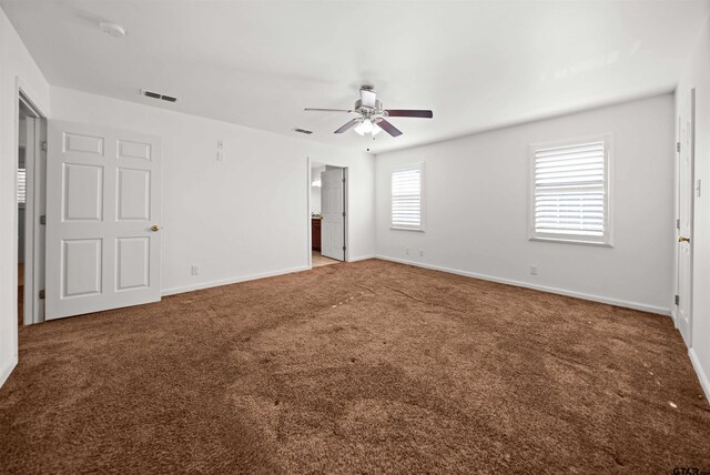 spare room featuring carpet flooring and ceiling fan