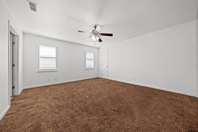 carpeted empty room featuring ceiling fan