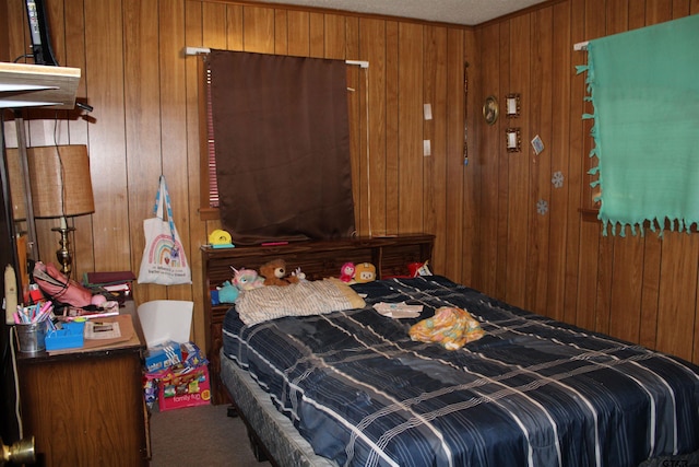 carpeted bedroom with wood walls