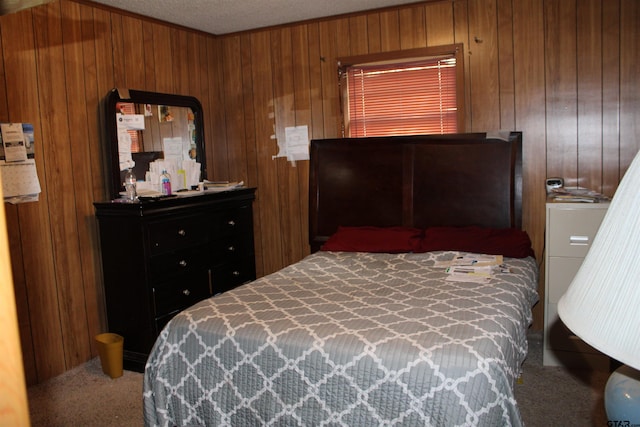 bedroom featuring carpet floors and wood walls