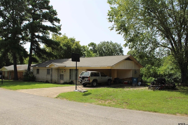 ranch-style home with a front yard and a carport