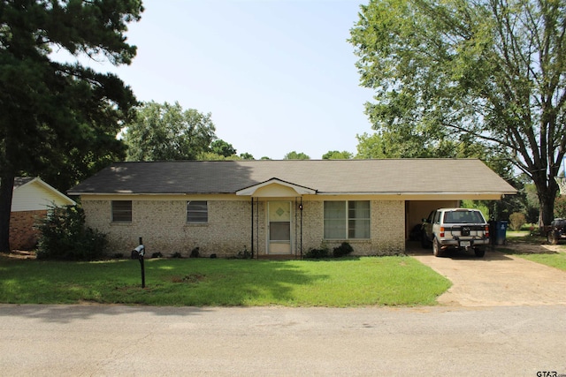 ranch-style home with a carport and a front lawn