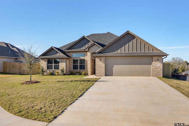 view of front of house featuring a front yard and a garage