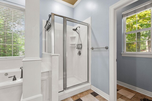 3631 River Oaks Ct, Tyler, TX 75707 - bathroom with a stall shower, ornamental molding, healthy amount of natural light, toilet, and baseboards