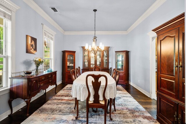 3631 River Oaks Ct, Tyler, TX 75707 - dining space with a chandelier, ornamental molding, baseboards, and dark wood-style floors