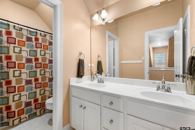 3631 River Oaks Ct, Tyler, TX 75707 - full bathroom with double vanity, toilet, tile patterned floors, curtained shower, and vaulted ceiling