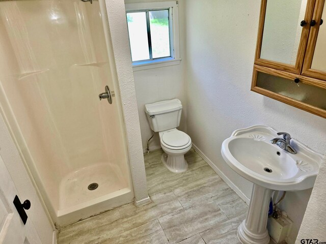 301 Harold St, Crockett, TX 75835 - bathroom with a stall shower and toilet