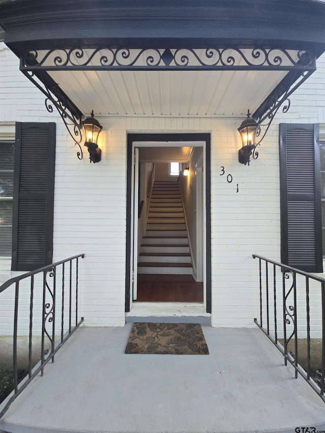 301 Harold St, Crockett, TX 75835 - property entrance featuring brick siding and covered porch