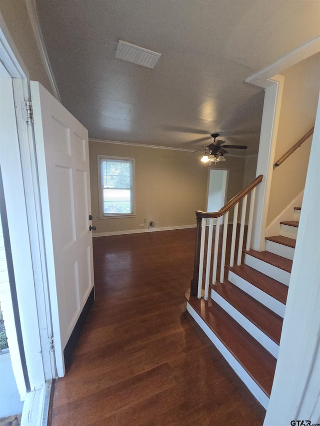 301 Harold St, Crockett, TX 75835 - entrance foyer with wood finished floors, ceiling fan, stairway, and ornamental molding